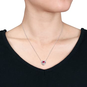 1 CT TGW Created Ruby and 1/5 CT TW Diamond Double Halo Heart Pendant
with Chain 10K White Gold