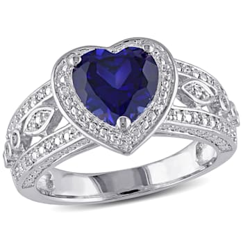 2 1/4 CT TGW Created Blue Sapphire and 1/10 CT TW Diamond Heart Ring in
Sterling Silver