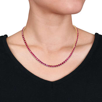 48 1/2 CT TGW Created Ruby Tennis Necklace in Yellow Gold Plated
Sterling Silver
