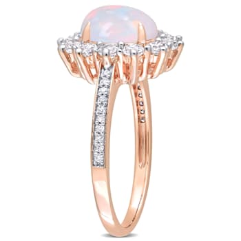2 1/6 CT TGW Blue Ethiopian Opal, White Topaz and Diamond Accent Ring in
Rose Plated Sterling Silver