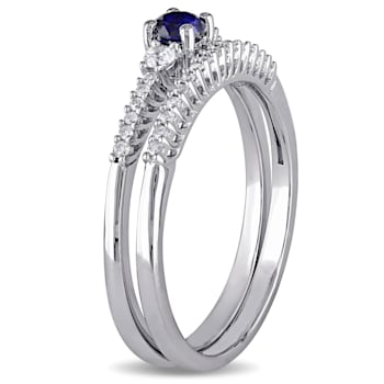 1/3 CTW Created Blue and Created White Sapphire with Diamond Accent Ring
Set in Sterling Silver