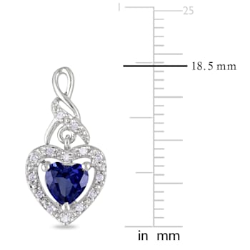 1 1/8 CT TGW Created Blue Sapphire and 1/8 CT TW Diamond Heart Twist
Earrings in Sterling Silver