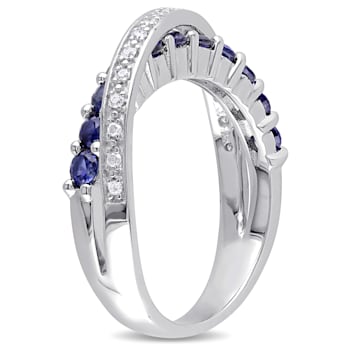 1 CT TGW Created Blue Sapphire and 1/10 CT TW Diamond Crossover Ring in
Sterling Silver