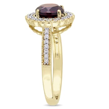 1 5/8 CTW Garnet and 1/8 CT TW Diamond Halo Ring in Yellow Plated
Sterling Silver
