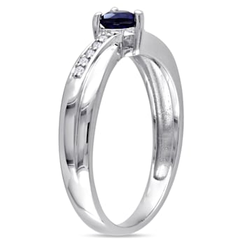1/4 CT TGW Created Blue Sapphire and Diamond Accent Heart Ring in
Sterling Silver