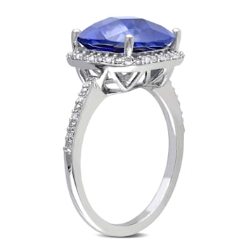 5 3/4 CT TGW Created Blue Sapphire and 1/10 CT TW Diamond Halo Ring in
Sterling Silver