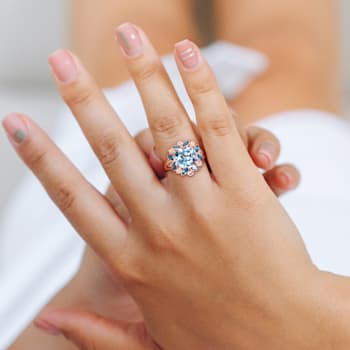 4 4/5 CT TGW London Blue, Sky Blue Topaz with White Topaz Floral Ring in
Rose Plated Sterling Silver