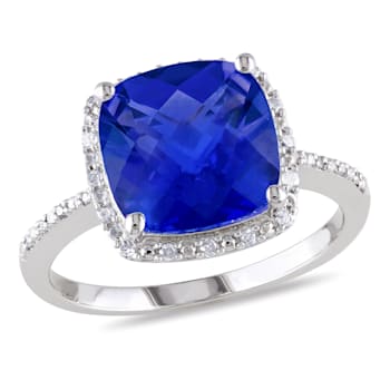5 3/4 CT TGW Created Blue Sapphire and 1/10 CT TW Diamond Halo Ring in
Sterling Silver
