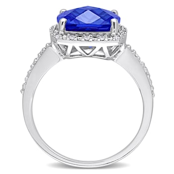 5 3/4 CT TGW Created Blue Sapphire and 1/10 CT TW Diamond Halo Ring in
Sterling Silver