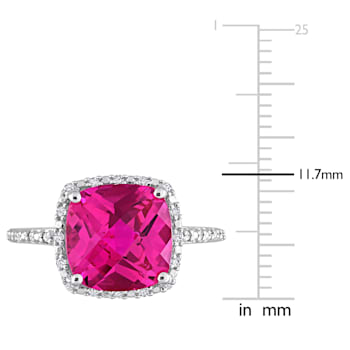 5 3/4 CT TGW Created Pink Sapphire and 1/10 CT TW Diamond Halo Ring in
Sterling Silver