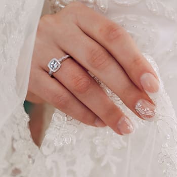 3/8 CT TGW Aquamarine and 1/10 CT TW Diamond Halo Ring in Sterling Silver