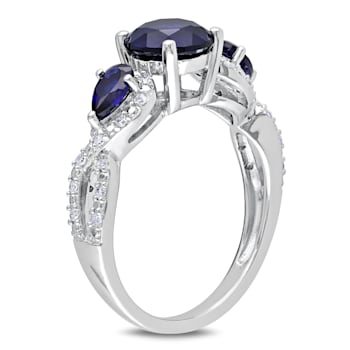 2 1/3 CTW Created Blue Sapphire and 1/6 CT TW Diamond Floral Ring in
Sterling Silver