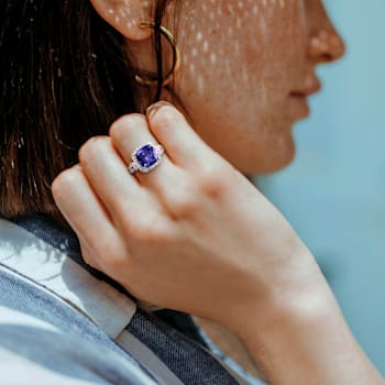6 3/4 CT TGW Created Tanzanite and Created White Sapphire Halo Ring in
Sterling Silver