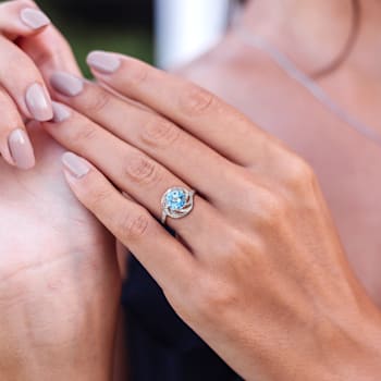 2 1/2 CT TGW Sky Blue and White Topaz with Diamond Accent Swirl Ring in
Sterling Silver