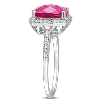 5 3/4 CT TGW Created Pink Sapphire and 1/10 CT TW Diamond Halo Ring in
Sterling Silver
