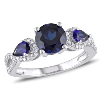2 1/3 CTW Created Blue Sapphire and 1/6 CT TW Diamond Floral Ring in
Sterling Silver