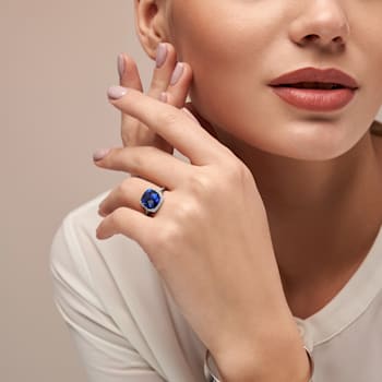 5 3/4 CT TGW Created Blue Sapphire and 1/10 CT TW Diamond Halo Ring in
Sterling Silver