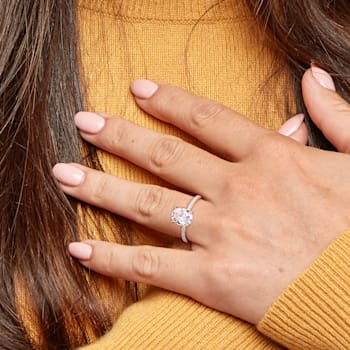 2 CT DEW Created Moissanite and 1/10 CT TW Diamond Engagement Ring in
14K Yellow Gold