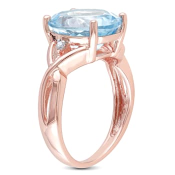 5 1/2 CT TGW Sky Blue Topaz and Diamond Accent Twist Ring in Rose Plated
Sterling Silver