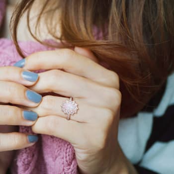 2 1/6 CT TGW Blue Ethiopian Opal, White Topaz and Diamond Accent Ring in
Rose Plated Sterling Silver