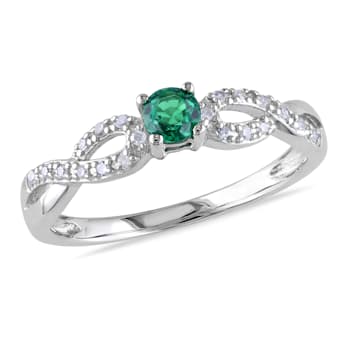 1/10 CT TGW Created Emerald and 1/10 CT TW Diamond Infinity Ring in
Sterling Silver
