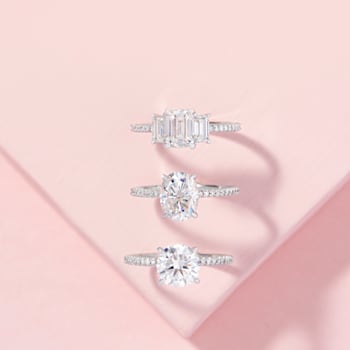 2 CT DEW Created Moissanite and 1/10 CT TW Diamond Engagement Ring in
14K White Gold