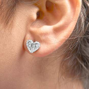 Sterling Silver 1/2 Cttw Round and Baguette Diamond Composite Heart
Shaped Stud Earring