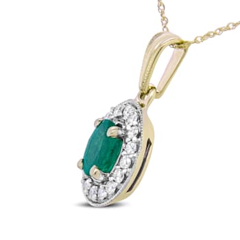 14K Yellow Gold 6x4mm Emerald and 1/5ctw Round Diamond Halo Pendant
w\chain 18"