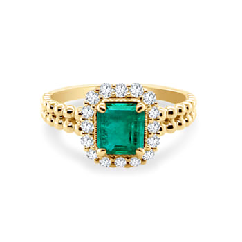 0.78Cts Colombian emerald, 0.31cw diamond, crafted in 18K yellow gold
center design ring.
