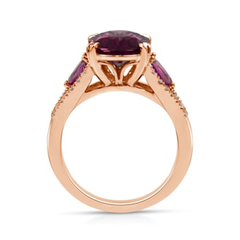 18KP 1/5 CTW Diamond Engagement Ring With 3 3/4 CTW Oval Garnet &
1/2 CTW Pear Garnet