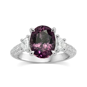 18KW 5/8 CTW Diamond Engagement Ring With 3 5/8 CTW Center Oval Garnet.