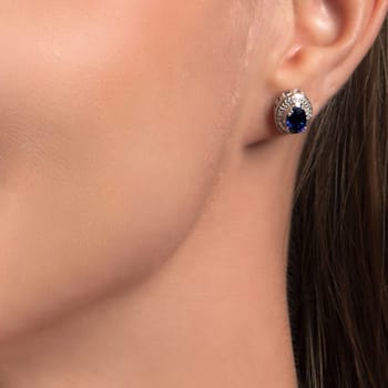 Sterling Silver 7x5 MM Oval Sapphire and Natural White Round Diamond
Stud Earrings