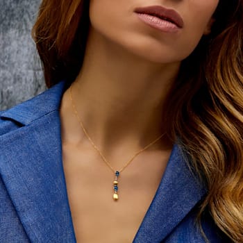 Dainty necklace in 18kt gold, London Blue Topaz and diamonds accent.