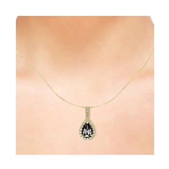 Black and White Diamond Halo Pendant With Chain Pear Drop in 14K Yellow
Gold With Chain (1.41 Cttw)