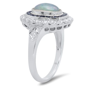 Beverley K 18K White Gold 0.35ctw Diamond and 0.76ctw Sapphire Ring set
with a 1.15ct Opal Center
