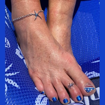 Sterling Silver Starfish Toe Ring with Blue CZ Center.