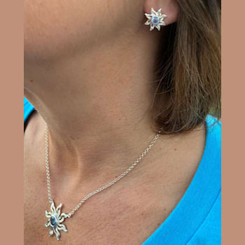 Sterling Silver Sun Stud Earrings with Blue CZ Centers.