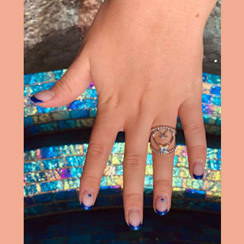 Sterling Silver Fishing Hook Heart Open Design Ring with Blue CZ Accent.