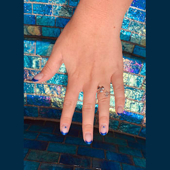 Sterling Silver Propeller-Anchor Ring with Rope Design and Blue CZ Accent.