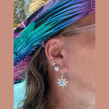 Sterling Silver Sun Dangle Earrings with Blue CZ Centers.
