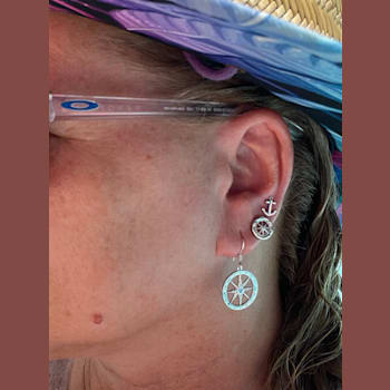 Sterling Silver Compass Dangle Earrings with Blue CZ Accents.