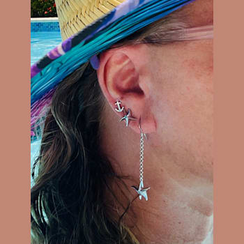 Sterling Silver Starfish Stud Earrings with Blue CZ Accents.
