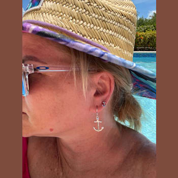 Sterling Silver Anchor Stud Earrings with Blue CZ Accents.
