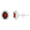 7x5mm Oval Garnet 1/5 ctw Diamond Rhodium Over Sterling Silver Halo Stud Earrings