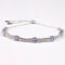 Rhodium Over Sterling Silver Oval Tanzanite and White Zircon Bolo
Bracelet 1.1ctw