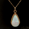 Ethiopian Opal Pear Shape Cabochon and Round Diamond 14K Yellow Gold
Pendant with Chain, 17.48ctw