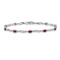 Rhodium Over 10k White Gold Diamond and Red Ruby Bracelet