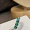 Lovely Emerald ring with 1.50 cts in 5 round shape, crafted in 14K white gold.