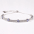 Rhodium Over Sterling Silver Oval Tanzanite and White Zircon Bolo
Bracelet 1.1ctw