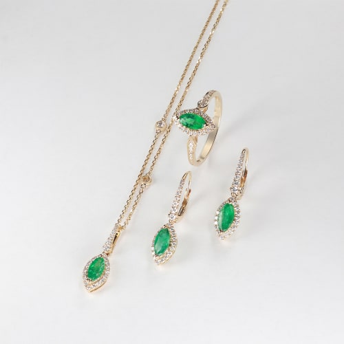 green gemstone jewelry in gold